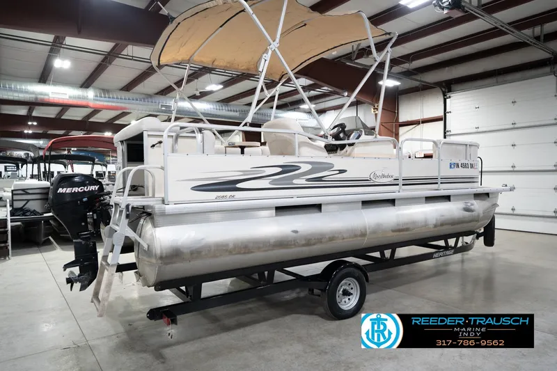 Slide: The Image of 2008 Misty Harbor 2085CR pontoon boat with Mercury outboard in indoor showroom. - 8