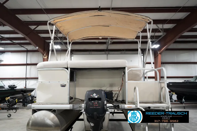 Slide: The Image of 2008 Misty Harbor 2085CR pontoon boat with canopy in indoor storage facility. - 9