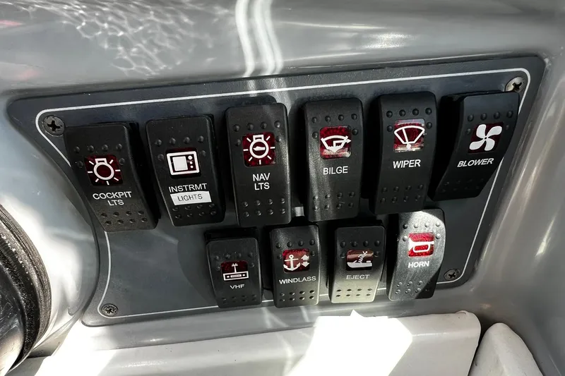 Slide: The Image of Control panel of a 1997 Formula 330 Sun Sport boat with safety warnings. - 14