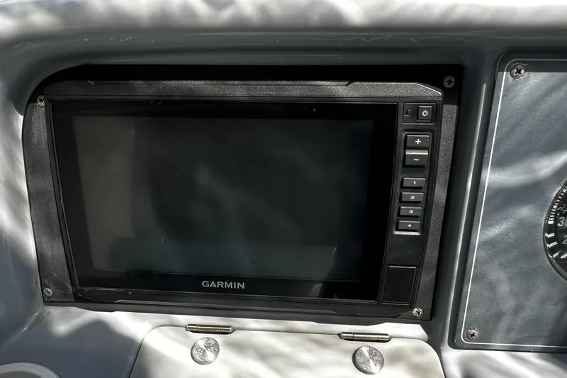 Slide: The Image of Control panel of a 1997 Formula 330 Sun Sport boat with various switches and indicators. - 16