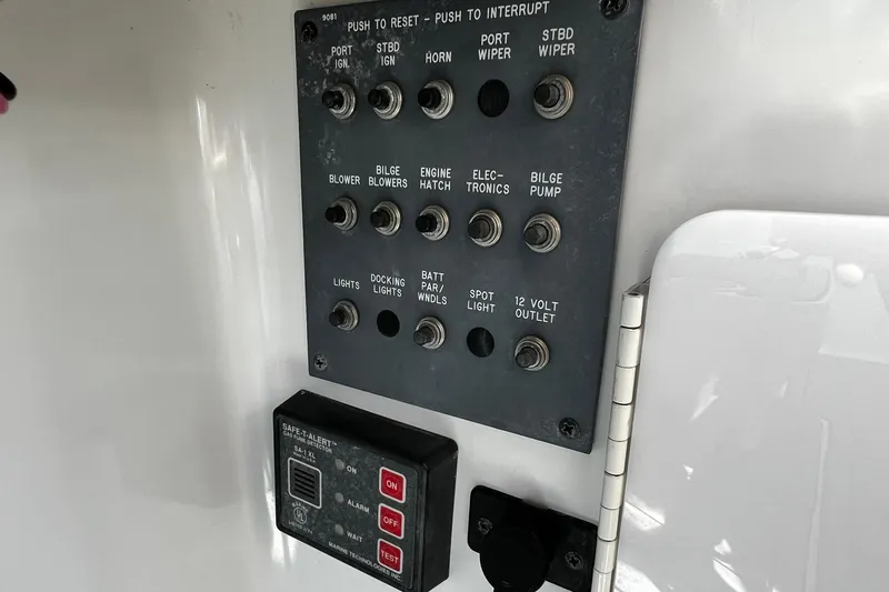 Slide: The Image of Wiring compartment of a 1997 Formula 330 Sun Sport boat, showing cables and connections. - 17