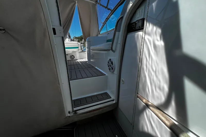 Slide: The Image of Interior view of 1997 Formula 330 Sun Sport boat canopy with metal supports. - 23