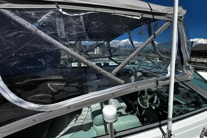 Slide: The Image of 1997 Formula 330 Sun Sport docked at a marina under a clear blue sky. - 25