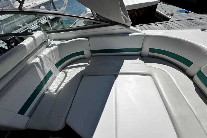 Slide: The Image of 1997 Formula 330 Sun Sport boat interior with white and green seating. - 5