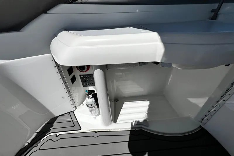 Slide: The Image of 1997 Formula 330 Sun Sport boat interior with white and green seating. - 9