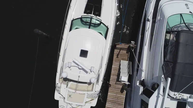 Slide: The Image of Aerial view of a 2013 Sea Ray 410 Sundancer docked at a marina. - 11