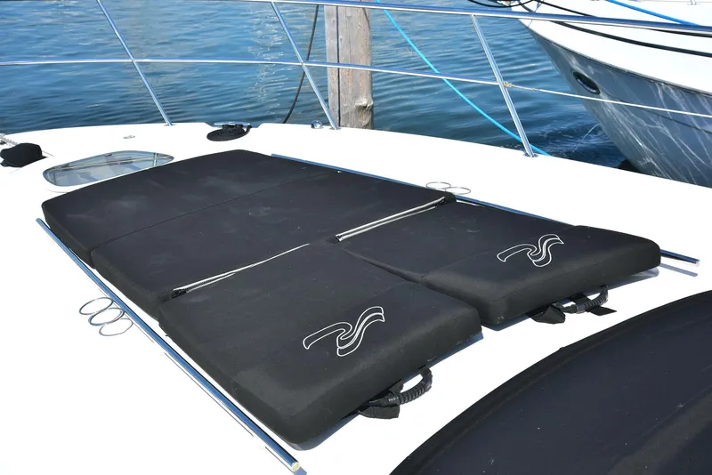 Slide: The Image of Sunbathing pads on 2013 Sea Ray 410 Sundancer yacht deck, near water. - 24