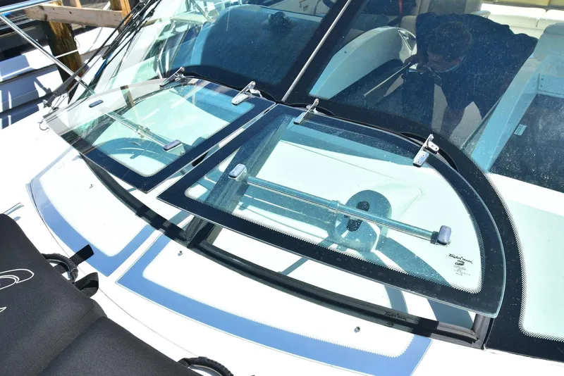 Slide: The Image of 2013 Sea Ray 410 Sundancer windshield and cockpit view. - 28