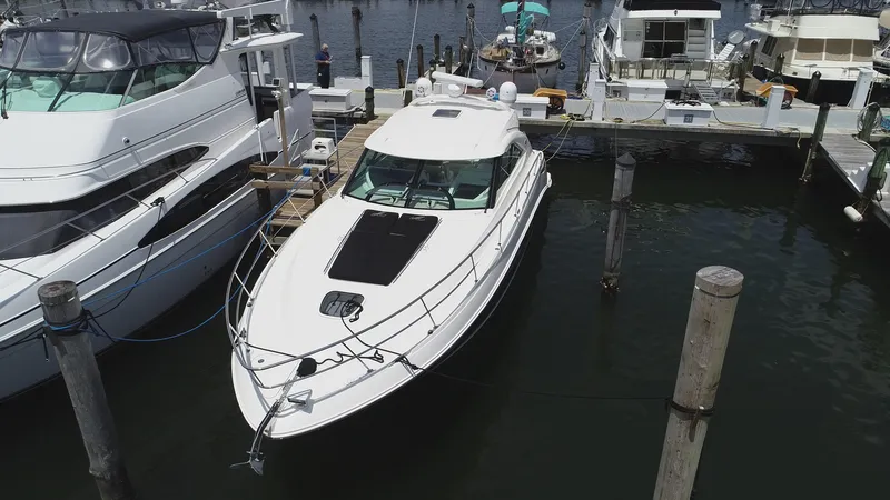 Slide: The Image of 2013 Sea Ray 410 Sundancer yacht docked at marina, aerial view. - 3