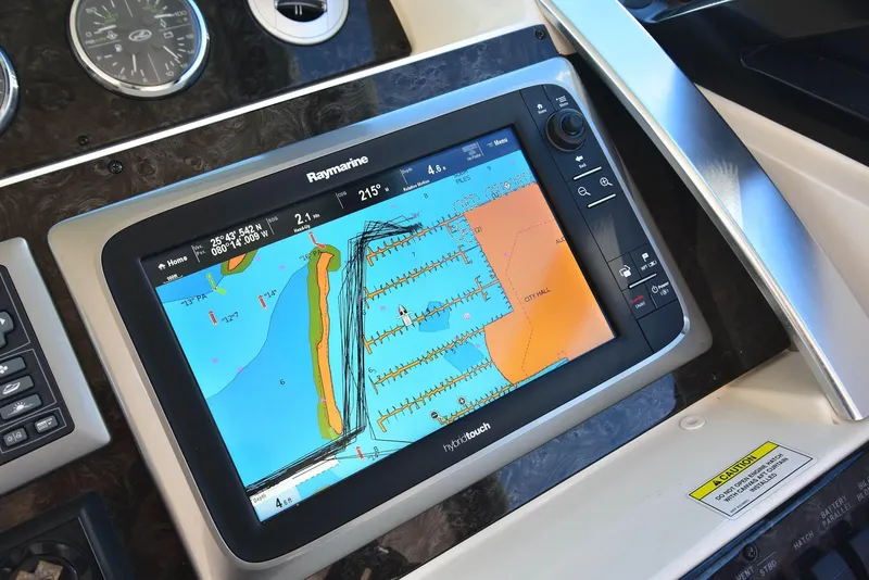 Slide: The Image of Raymarine navigation display on 2013 Sea Ray 410 Sundancer yacht dashboard. - 33
