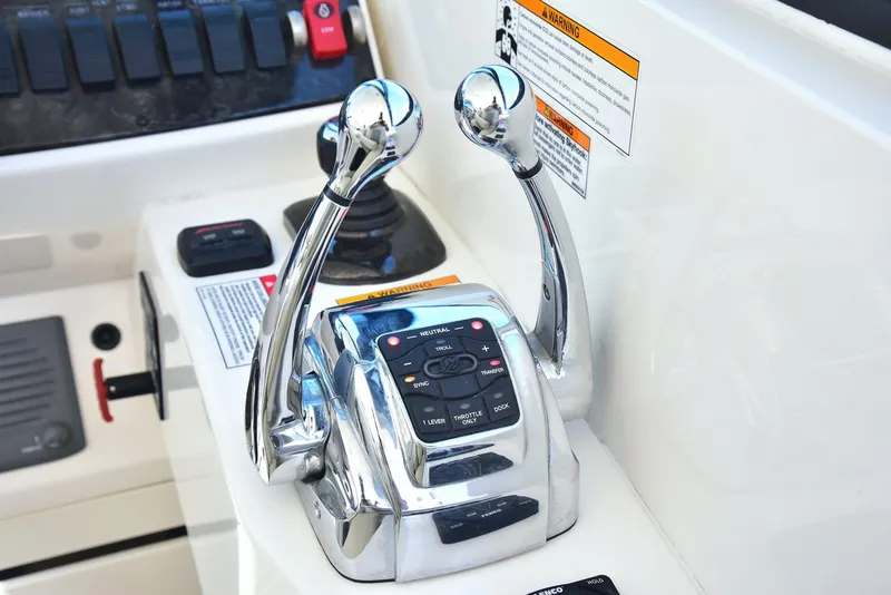 Slide: The Image of Chrome throttle controls on 2013 Sea Ray 410 Sundancer boat dashboard. - 41