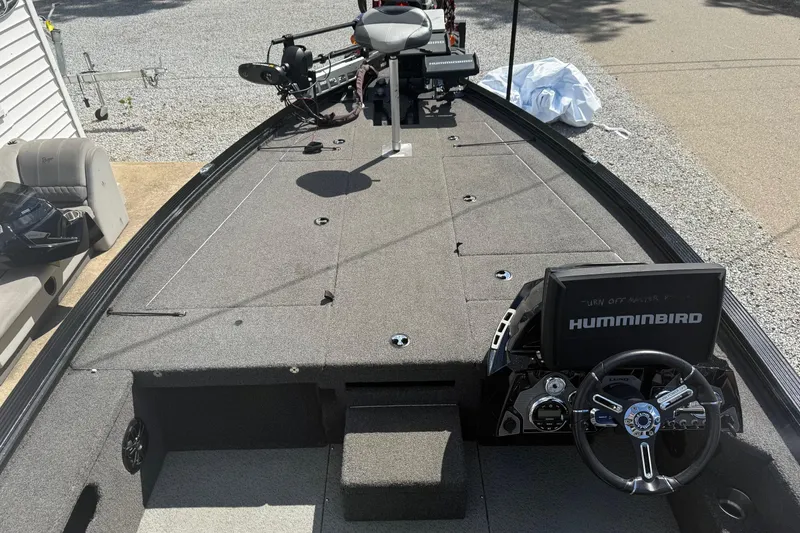 Slide: The Image of 2021 Lund 2075 Pro-V Bass boat interior with Humminbird electronics and steering wheel. - 11
