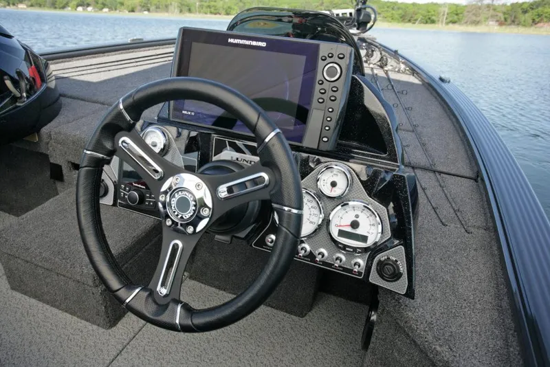 Slide: The Image of Manufacturer Provided Image: 2021 Lund 2075 Pro-V Bass boat dashboard with steering wheel and Humminbird fish finder. - 19