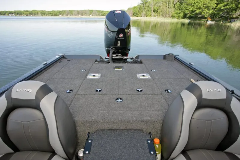 Slide: The Image of Manufacturer Provided Image: 2021 Lund 2075 Pro-V Bass boat interior with motor on a calm lake. - 20