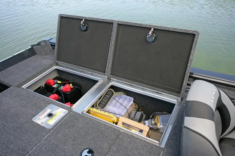 Slide: The Image of Manufacturer Provided Image: 2021 Lund 2075 Pro-V Bass boat storage compartments with fishing gear and batteries. - 27