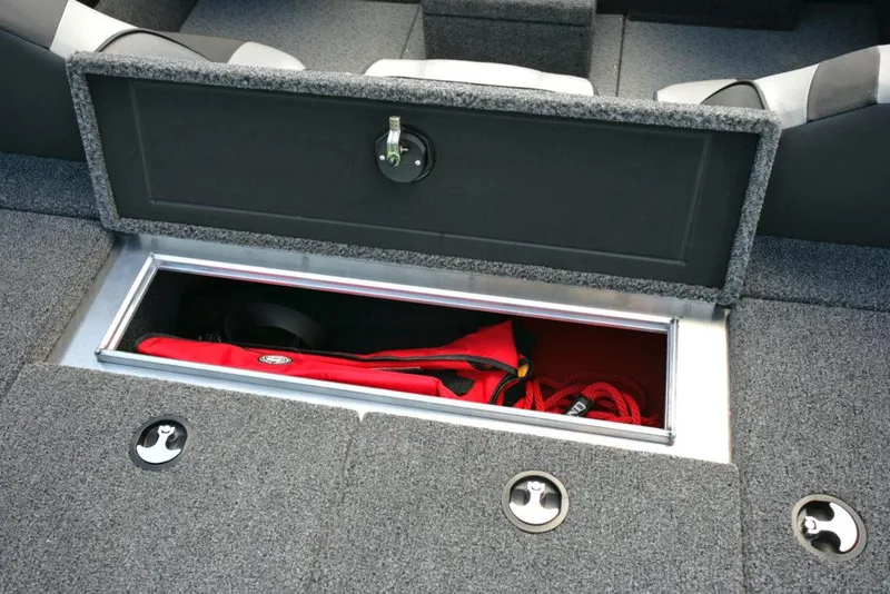 Slide: The Image of Manufacturer Provided Image: 2021 Lund 2075 Pro-V Bass boat storage compartment with red life jacket. - 29