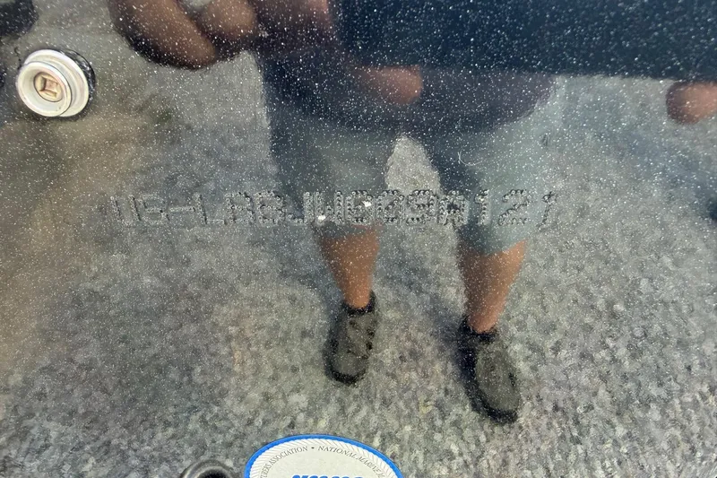 Slide: The Image of 2021 Lund 2075 Pro-V Bass boat hull identification number with reflection. - 3