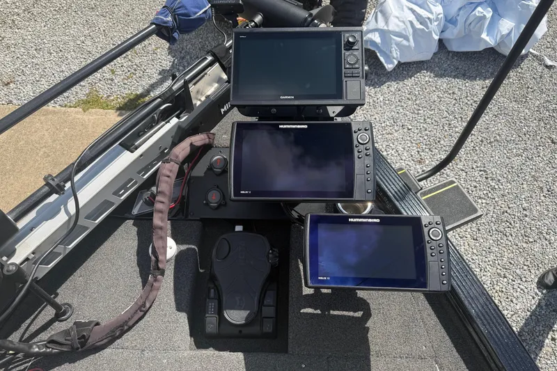 Slide: The Image of 2021 Lund 2075 Pro-V Bass boat with advanced fish finders and navigation equipment. - 9