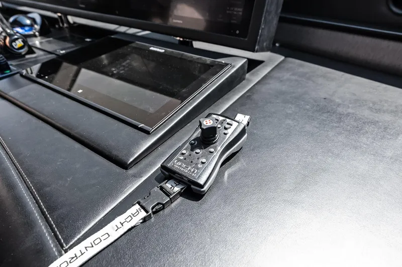 Slide: The Image of Control panel of 2006 Lazzara Skylounge yacht with joystick and touchscreen display. - 20