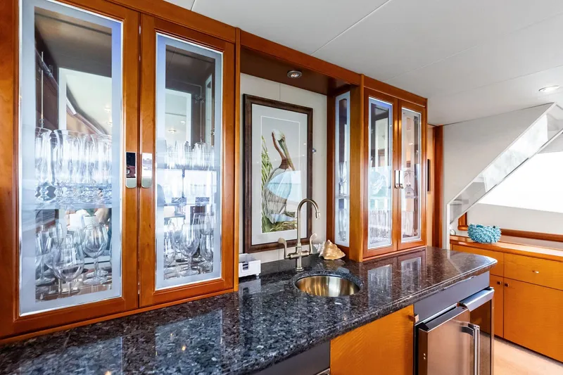 Slide: The Image of Luxurious 2006 Lazzara Skylounge yacht interior with elegant glass cabinets and granite countertop. - 24