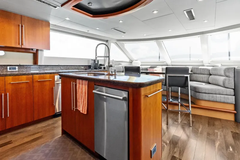 Slide: The Image of Luxurious 2006 Lazzara Skylounge yacht interior with modern kitchen and dining area. - 30