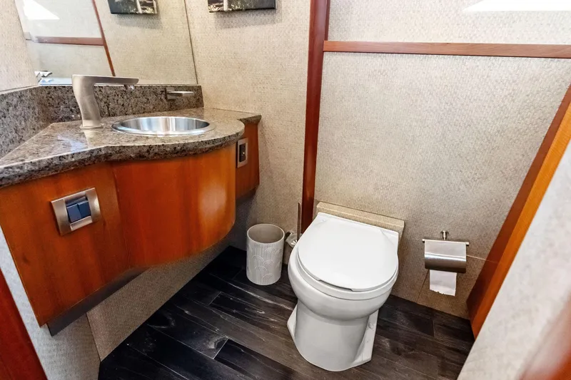 Slide: The Image of Luxurious bathroom in 2006 Lazzara Skylounge yacht with modern fixtures and elegant design. - 33