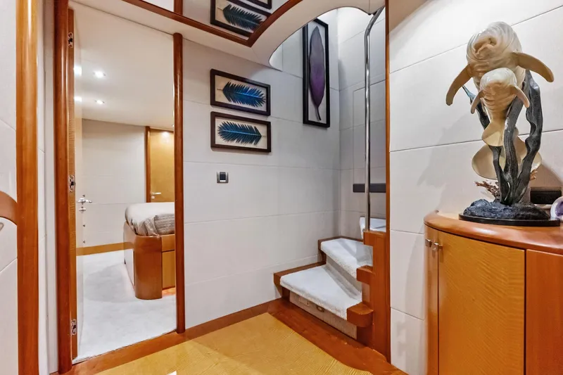 Slide: The Image of Luxurious interior of 2006 Lazzara Skylounge yacht with elegant decor and staircase. - 44