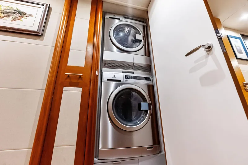 Slide: The Image of Stacked washer and dryer in 2006 Lazzara Skylounge yacht interior. - 46