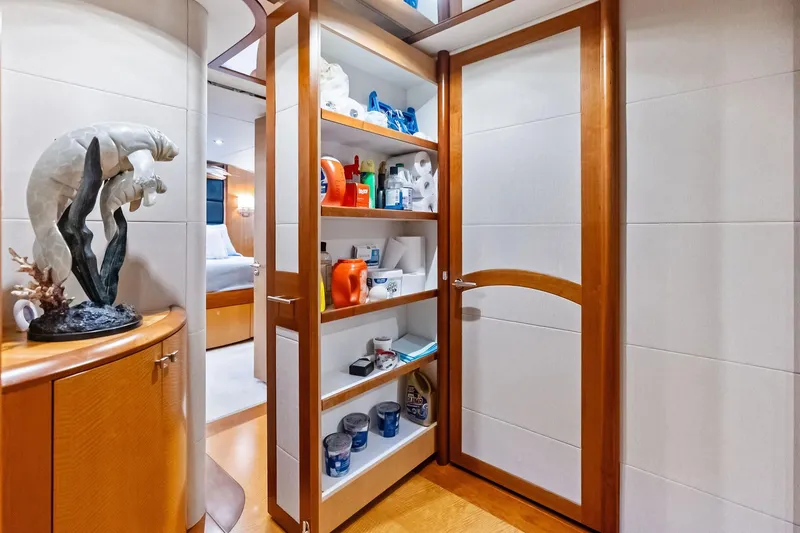 Slide: The Image of Luxurious 2006 Lazzara Skylounge yacht interior with open storage shelves and elegant decor. - 47