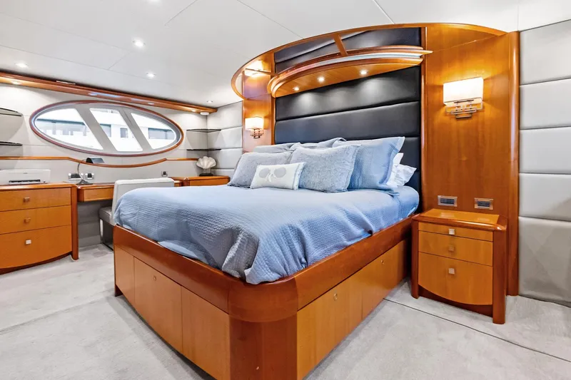 Slide: The Image of Luxurious 2006 Lazzara Skylounge yacht bedroom with elegant wood furnishings and modern design. - 49