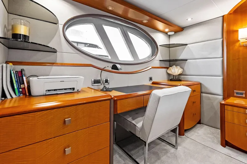 Slide: The Image of Luxurious 2006 Lazzara Skylounge yacht interior with elegant wood desk and modern decor. - 50