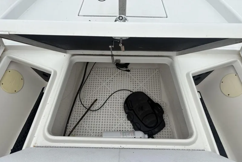 Slide: The Image of Open storage compartment on 2003 Ranger 2300 Bay Ranger boat, showing interior details. - 10