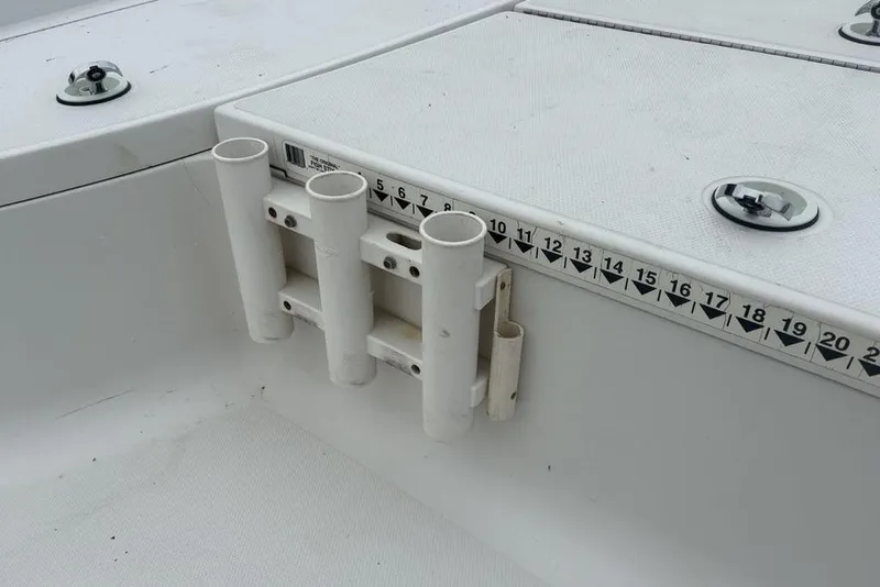 Slide: The Image of 2003 Ranger 2300 Bay Ranger boat with rod holders and measurement scale. - 15