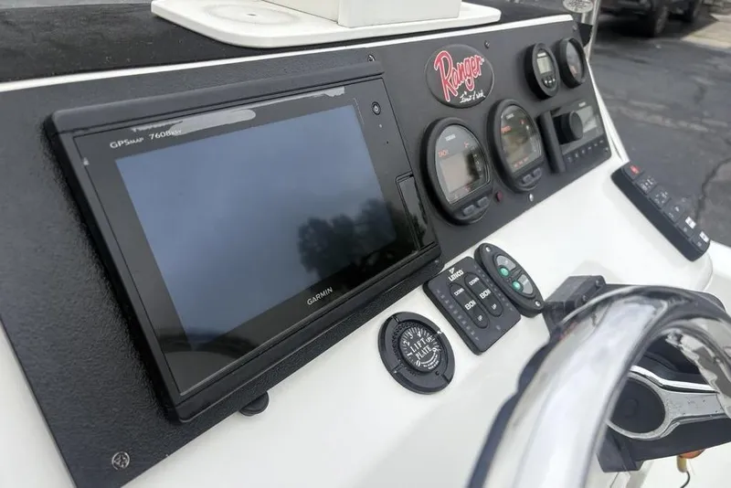 Slide: The Image of Dashboard of 2003 Ranger 2300 Bay Ranger boat with Garmin GPS and controls. - 18
