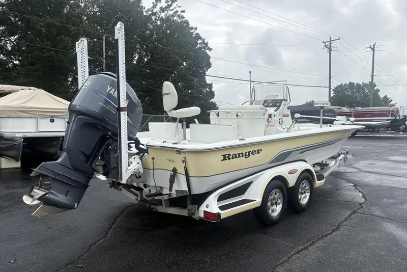 Slide: The Image of 2003 Ranger 2300 Bay Ranger boat with Yamaha outboard motor on trailer. - 2