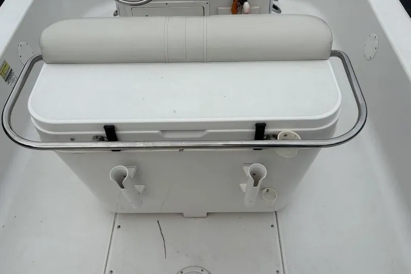 Slide: The Image of 2003 Ranger 2300 Bay Ranger boat seat with integrated cooler and rod holders. - 21