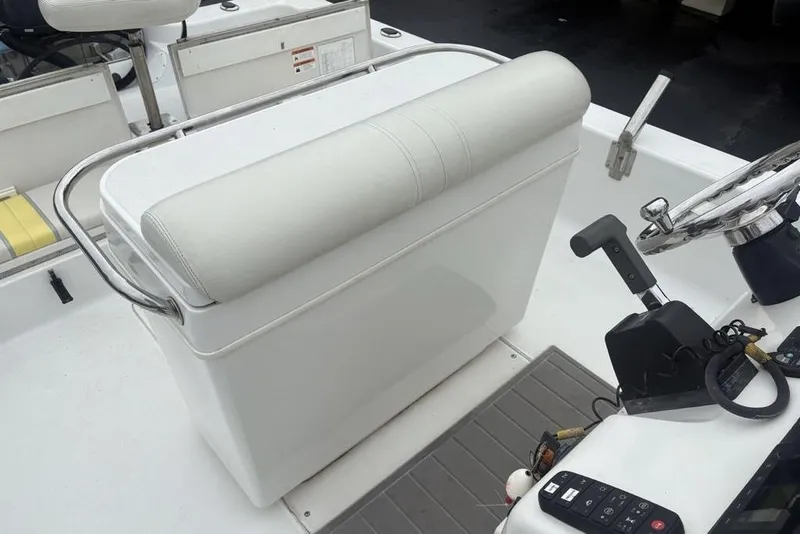 Slide: The Image of 2003 Ranger 2300 Bay Ranger boat interior with steering wheel and seating area. - 22