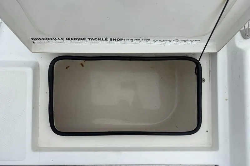 Slide: The Image of Open storage compartment on 2003 Ranger 2300 Bay Ranger boat with Greenville Marine Tackle Shop label. - 23