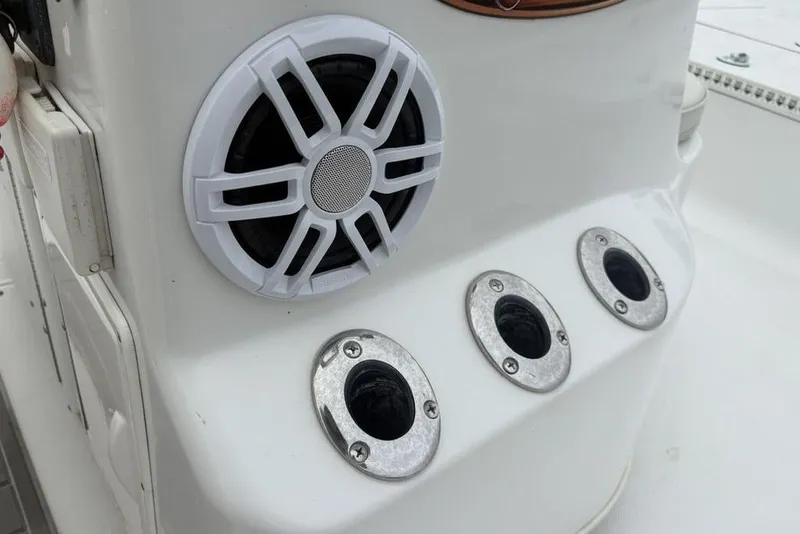Slide: The Image of Close-up of a 2003 Ranger 2300 Bay Ranger boat speaker and rod holders. - 25