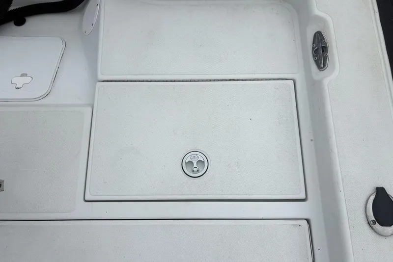 Slide: The Image of Deck of 2003 Ranger 2300 Bay Ranger boat with storage compartments. - 26