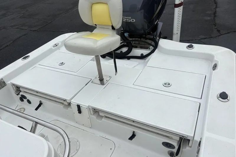 Slide: The Image of 2003 Ranger 2300 Bay Ranger boat deck with seating and Yamaha 250 engine. - 27