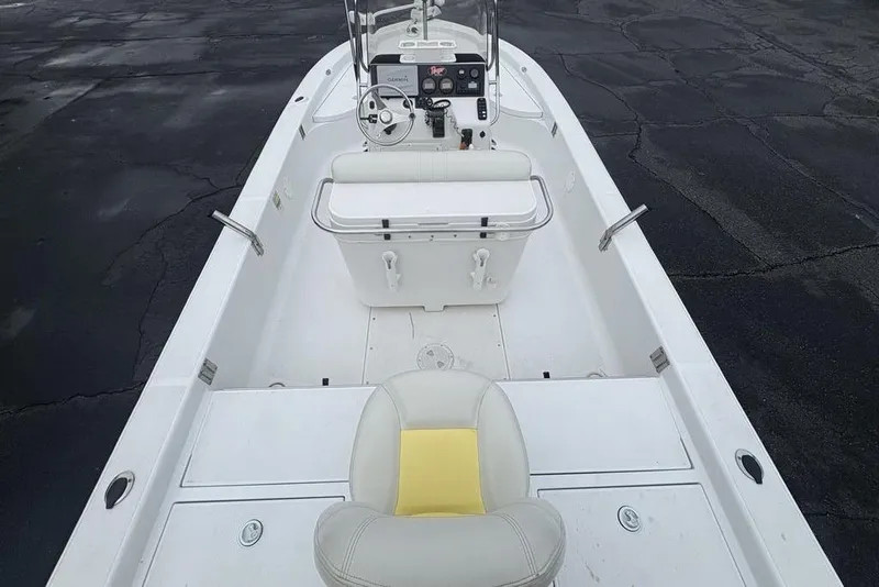 Slide: The Image of 2003 Ranger 2300 Bay Ranger boat interior with steering console and seating. - 31
