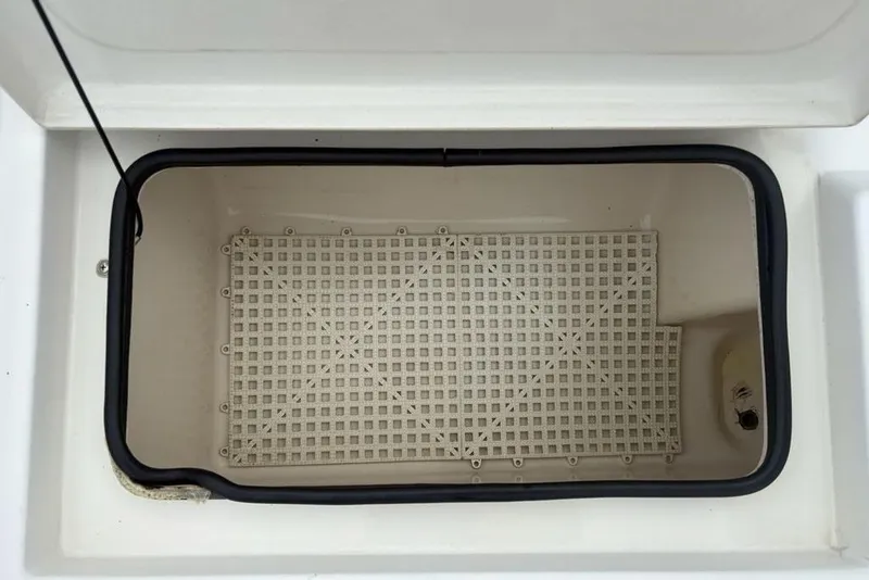 Slide: The Image of Open storage compartment in 2003 Ranger 2300 Bay Ranger boat. - 32