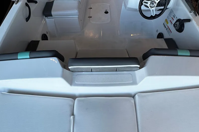 Slide: The Image of Interior view of 2026 Tahoe T18 boat, featuring seating and steering wheel. - 4