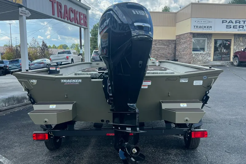 Slide: The Image of 2026 Tracker Grizzly 2072 CC boat with Mercury engine at dealership. - 2
