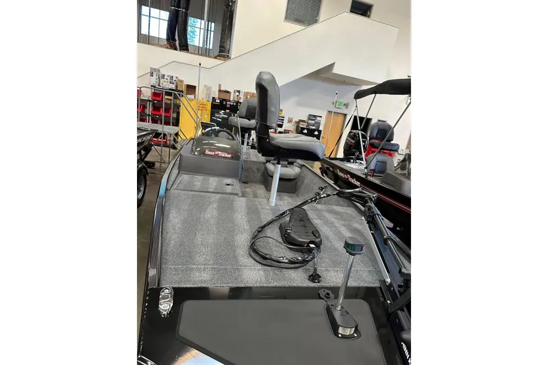 Slide: The Image of 2026 Tracker Bass Tracker Classic XL boat interior with seating and equipment. - 2