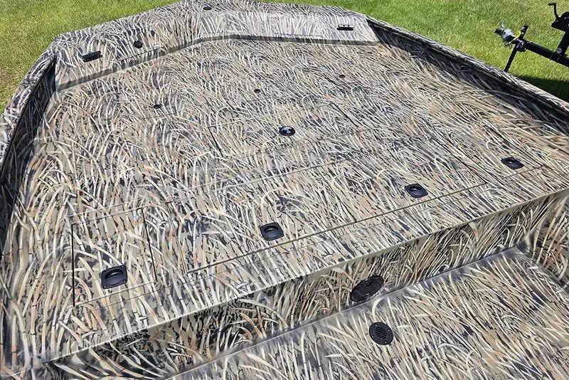 Slide: The Image of 2026 Tracker Grizzly 2072 CC boat with camouflage deck pattern. - 13