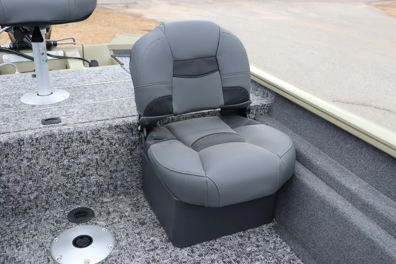 Slide: The Image of 2026 Tracker Pro Team 175 Crappie Edition boat seat, gray upholstery, carpeted deck. - 10