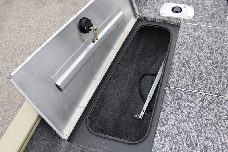Slide: The Image of Open storage compartment on 2026 Tracker Pro Team 175 Crappie Edition boat. - 6
