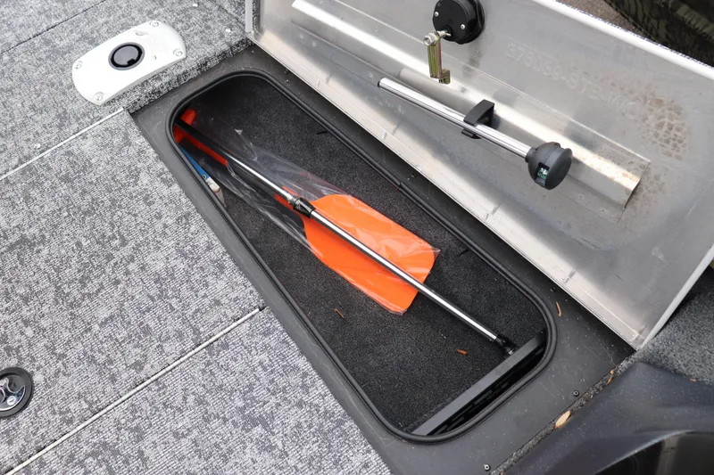 Slide: The Image of Open storage compartment in 2026 Tracker Pro Team 175 Crappie Edition boat. - 7